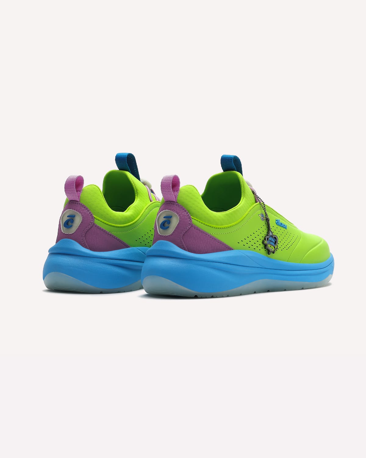 Colorful sneakers with green, blue, and purple accents on a white background