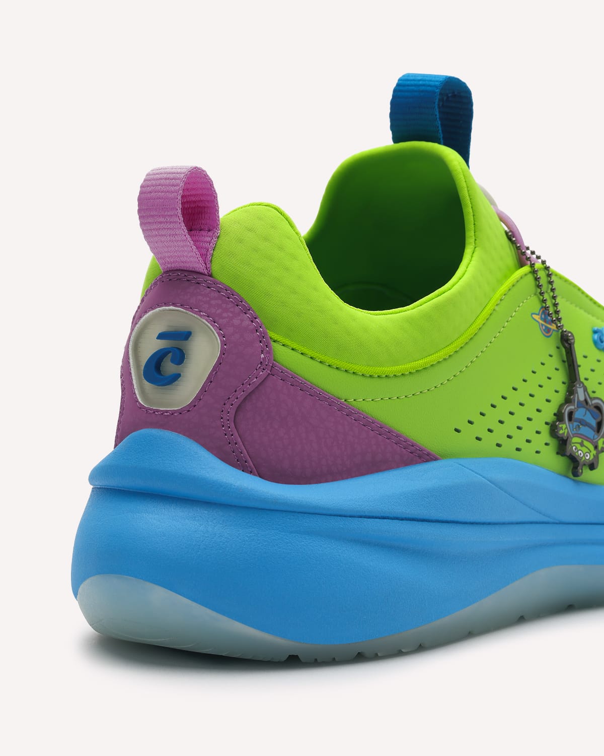 Colorful shoe with green, purple, and blue design on a white background