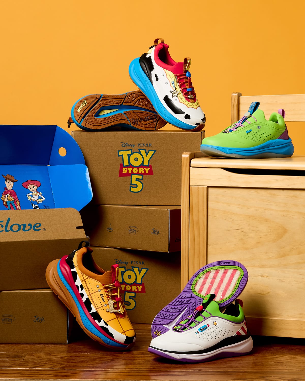 Colorful shoes with 'Toy Story 5' branding on a wooden surface.