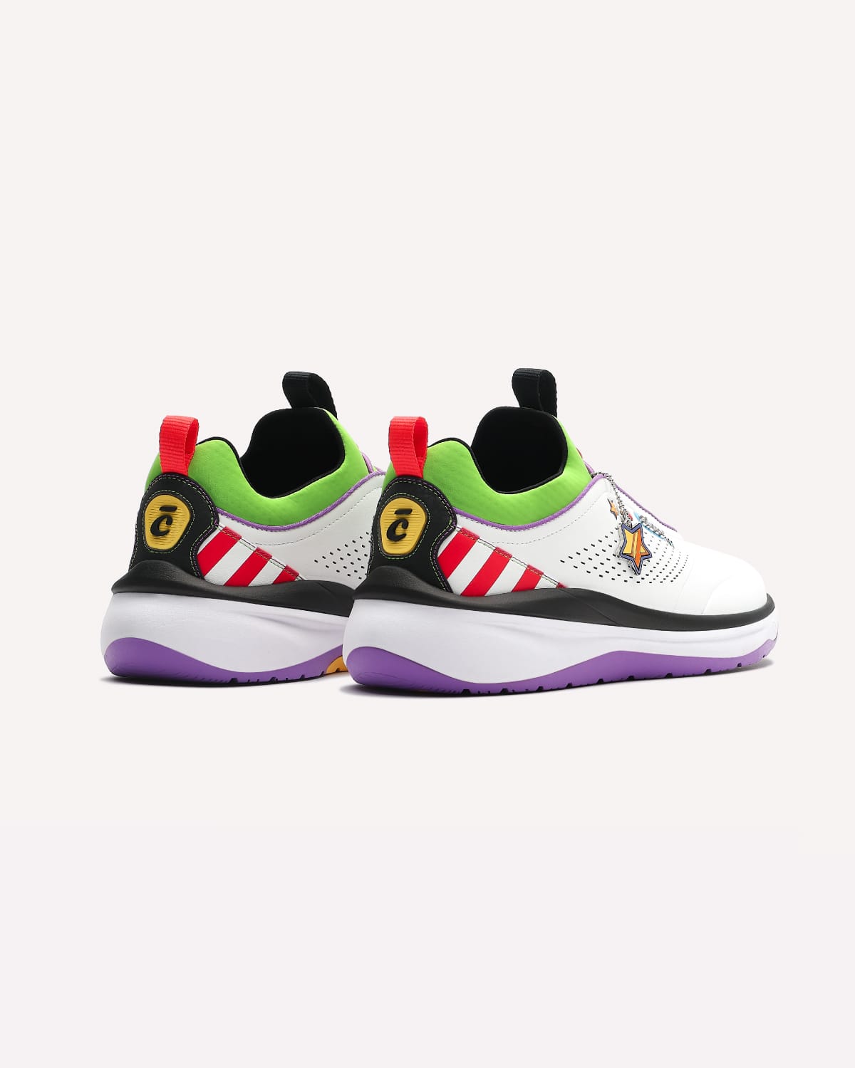Pair of colorful sneakers with unique design elements on a light gray background