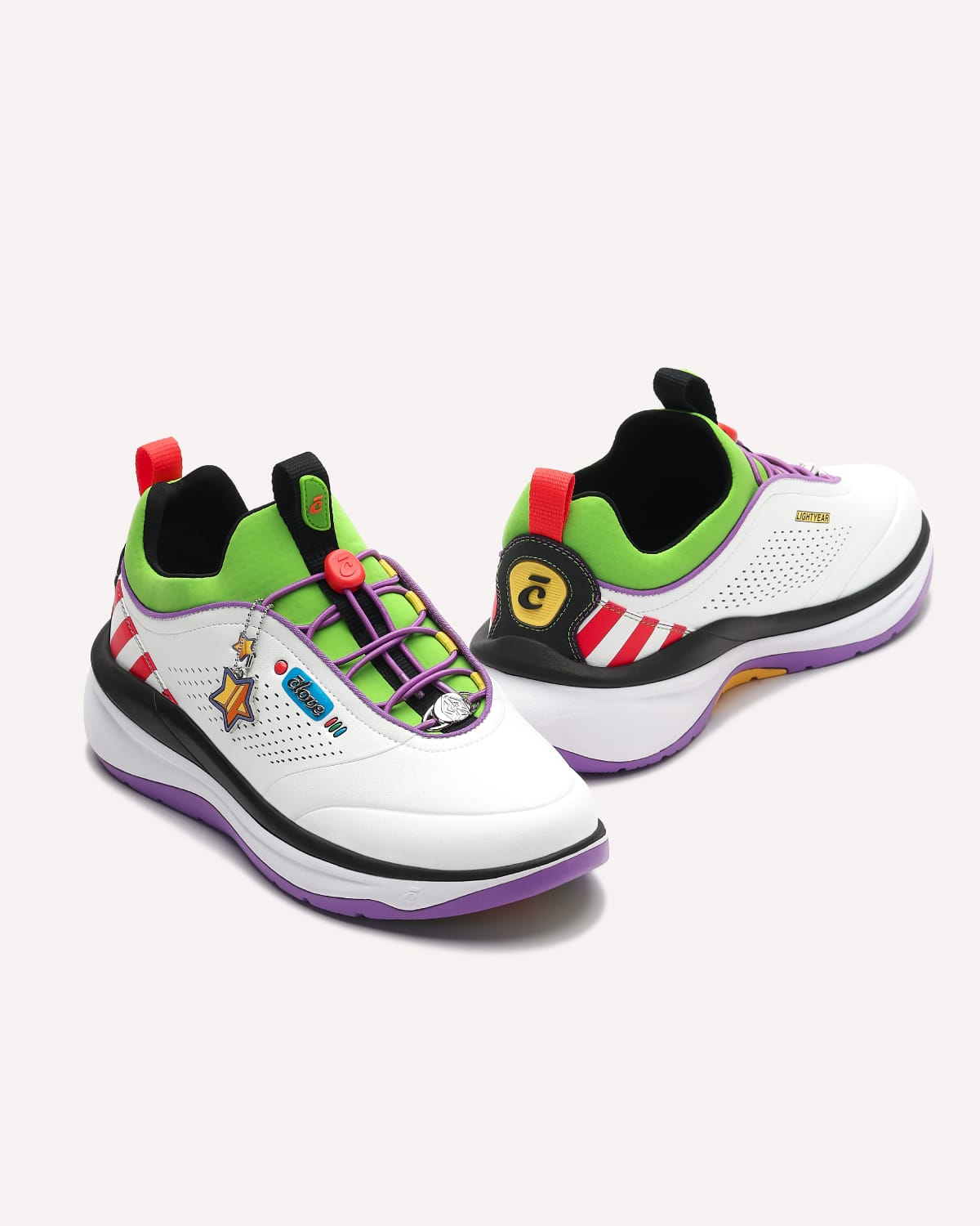 Pair of colorful shoes with cartoon character designs on a white background