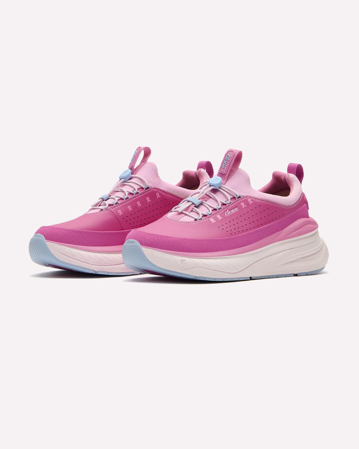 A pair of pink platform sneakers with light blue accents on the bottoms and laces, displayed against a clean off-white background.
