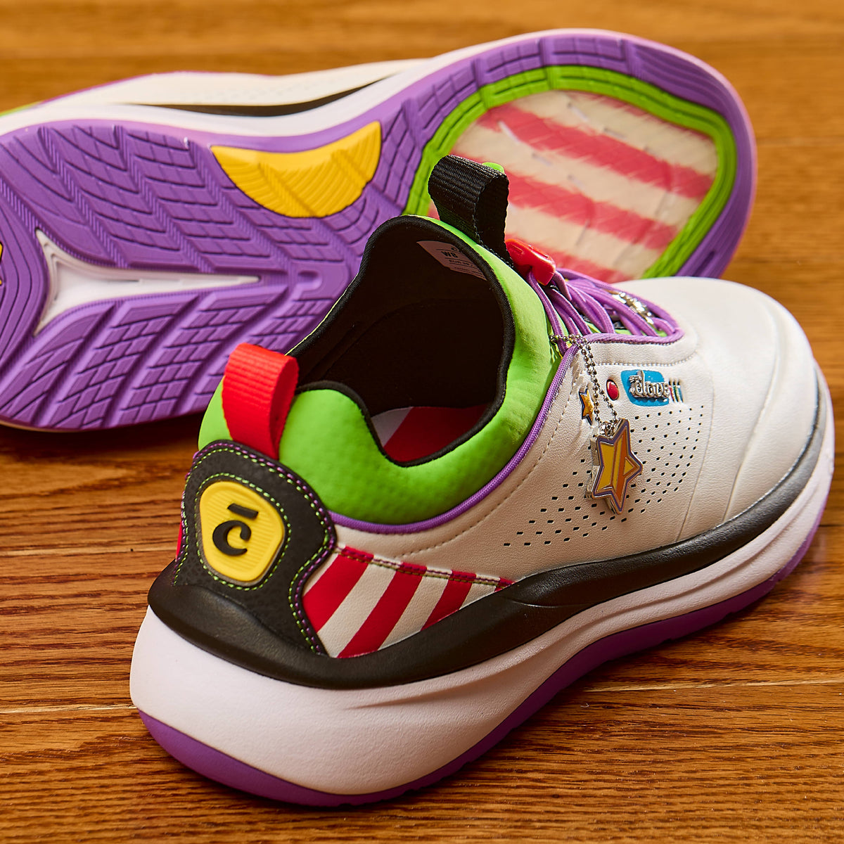 Colorful sneaker with unique design elements on a wooden surface