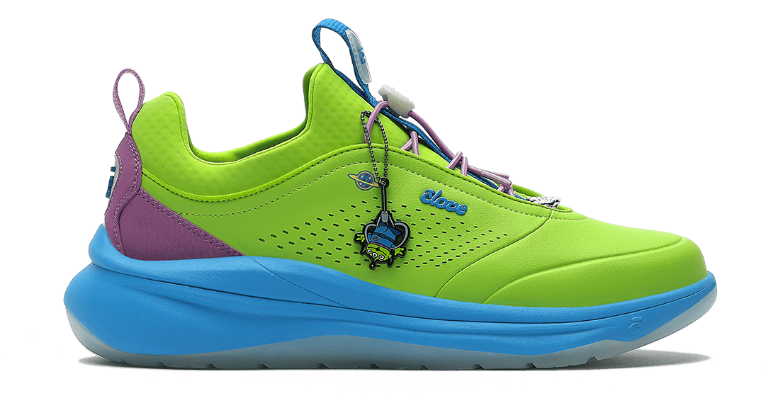 Colorful sneaker with a bright green sole, purple side panel, and blue accents on a white background