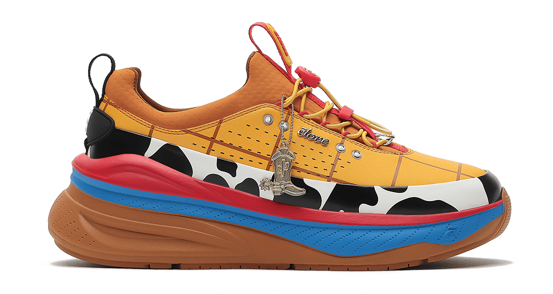 Multicolored sneaker with cow print pattern on a white background