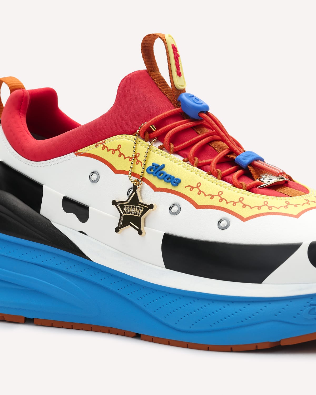 Colorful sneaker with red, yellow, blue, and black design on a white background