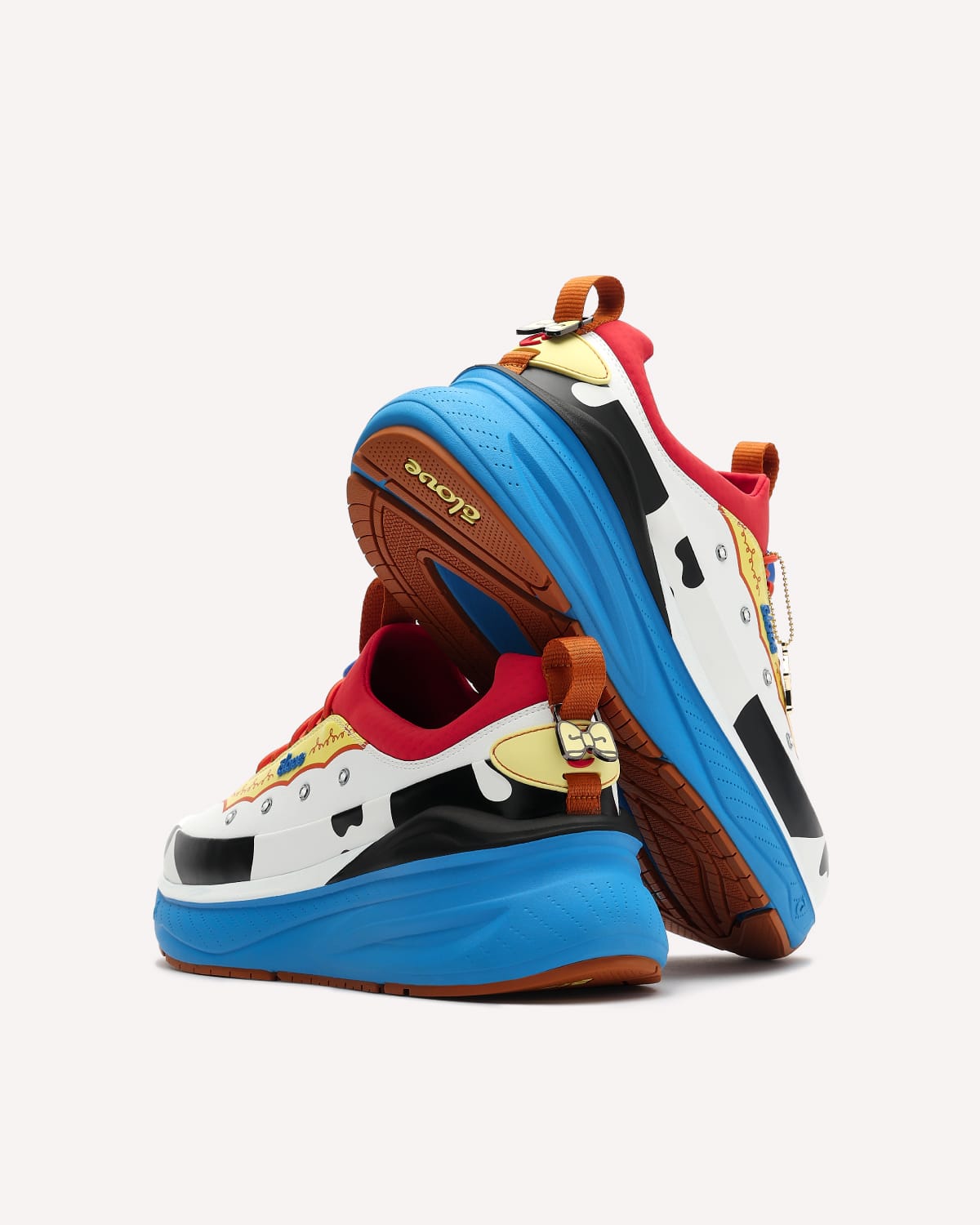 Colorful sneakers with cartoon character design on a white background