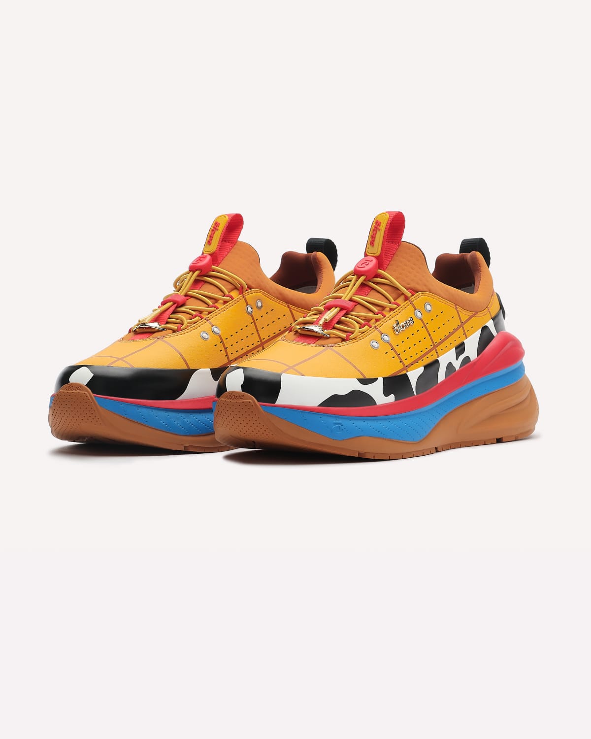 Colorful sneakers with a cow print pattern on a white background