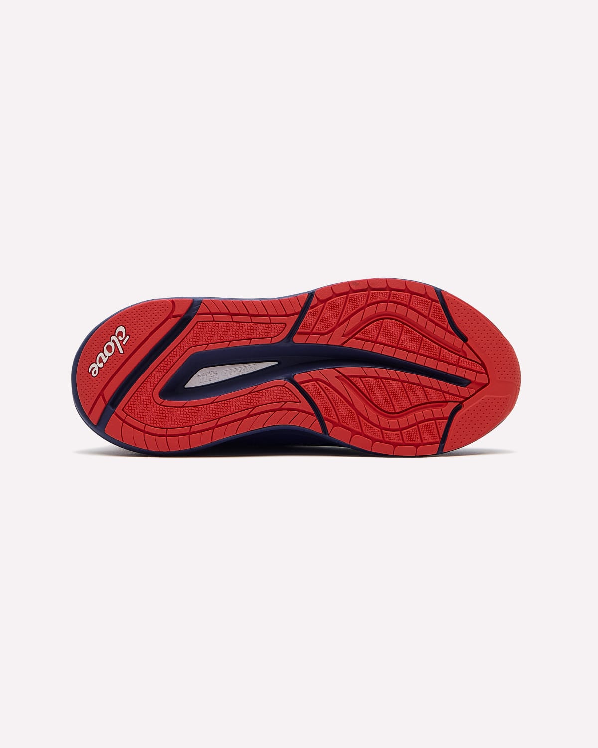 The red and navy blue sole of a shoe, showing the textured tread pattern and brand name, photographed on a light gray background.