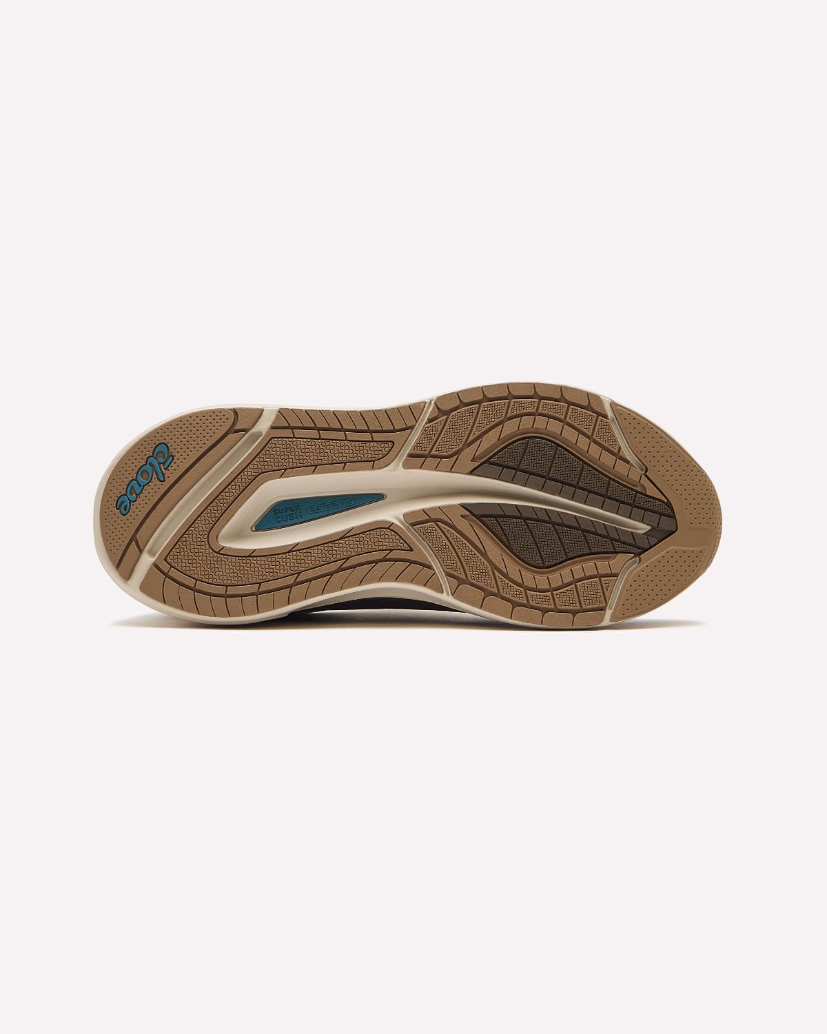 The outsole of a shoe shown from a top-down view, featuring a brown and beige textured tread pattern with a small teal accent near the heel.