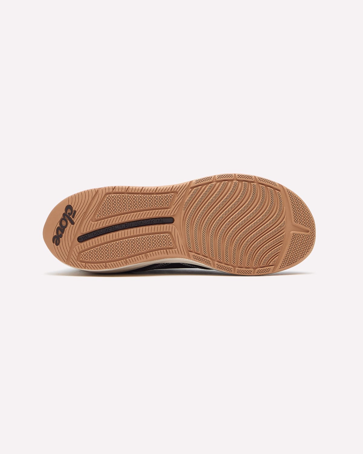 The outsole of a shoe in tan rubber with a black brand logo and tread pattern, shown against a light gray background.